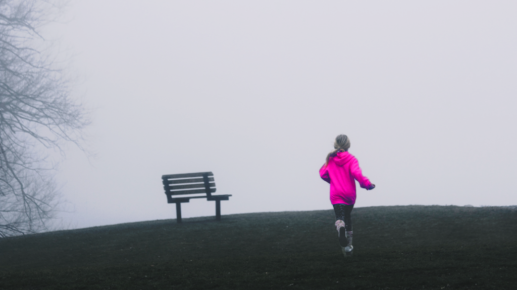 Child running uphill outside to take a break from worries about mum or dad drinking too much