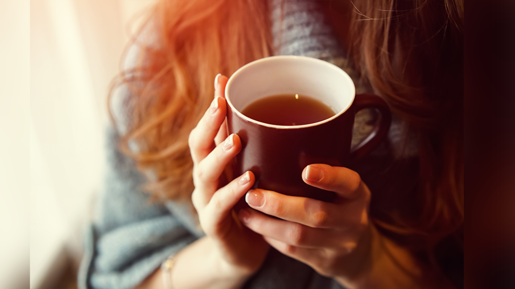 Person holding mug of tea to remind people affected by someone's drinking to look after themselves too
