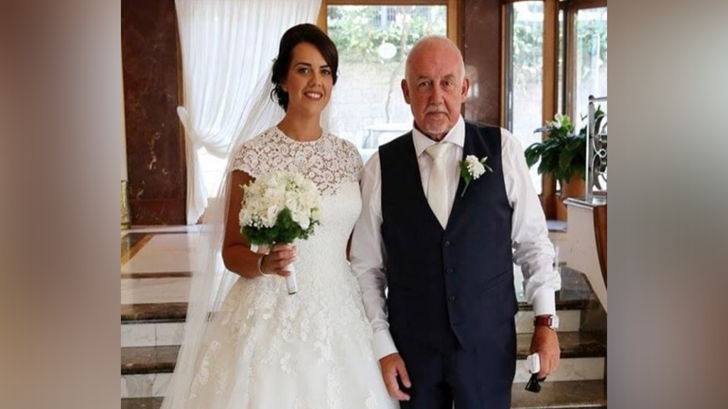 Wedding photo of bride in white wedding dress with father in waistcoat shared to raise awareness that he didn't choose to become alcoholic