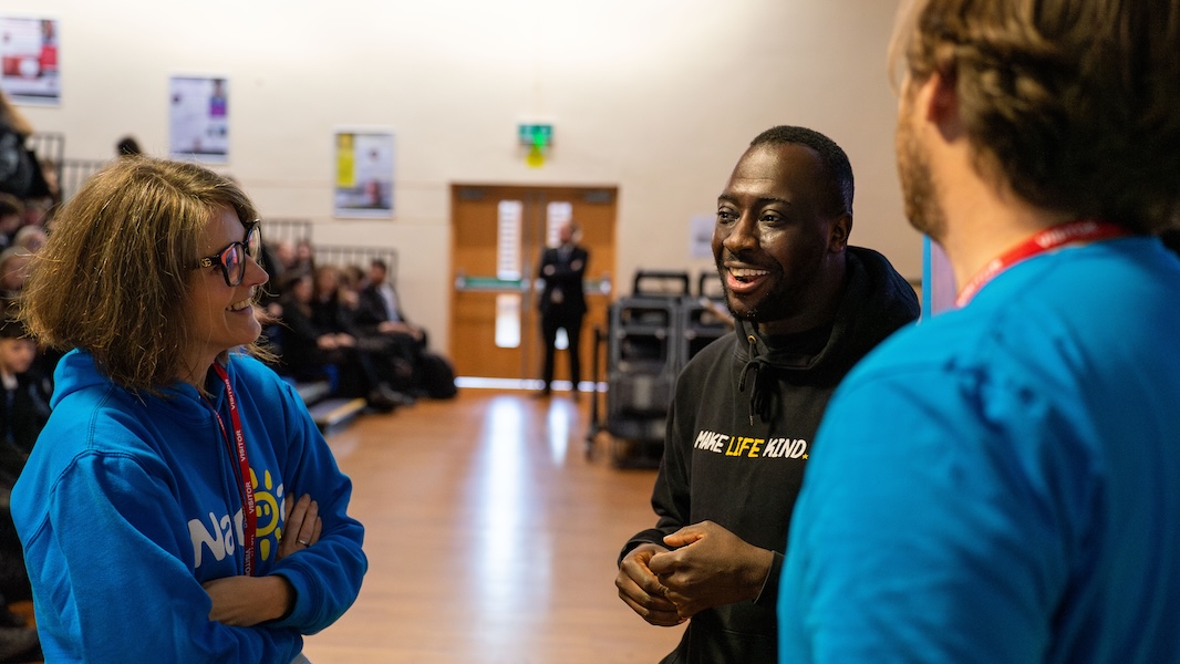 Volunteers speaking in a school about the impact of parent's drinking problems and what can help